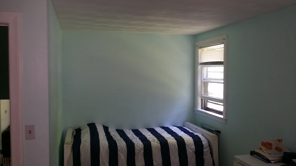 41 Audrea Road Framingham, MA 01701 - Photo 8 of 10 a view of a bedroom with wooden floor