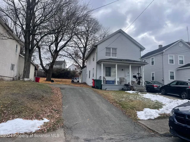 a view of a house with couches in front of house
