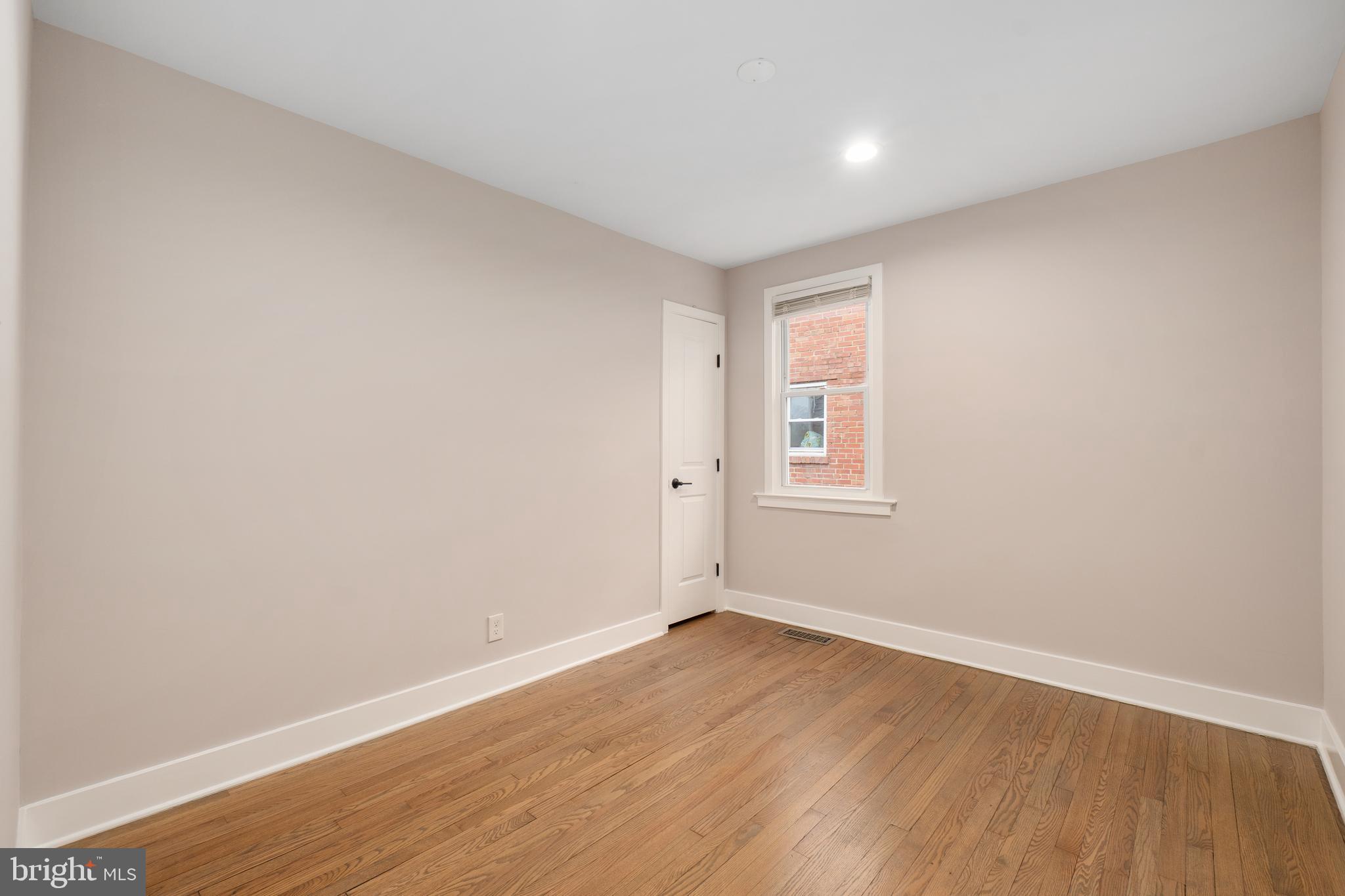 50 53rd Street Southeast Washington, DC 20019 - Photo 18 of 35 an empty room with wooden floor and windows