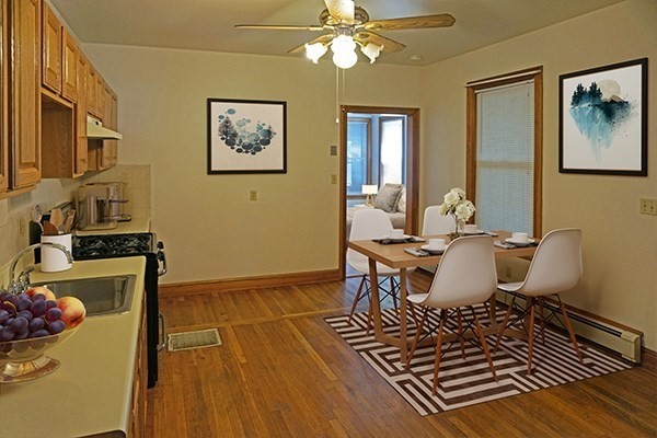 85 Brown Street, Unit 1 Waltham, MA 02453 - Photo 2 of 7 a living room with furniture and a rug