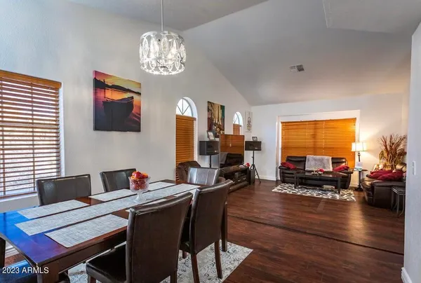 a view of a dining room with furniture window and wooden floor