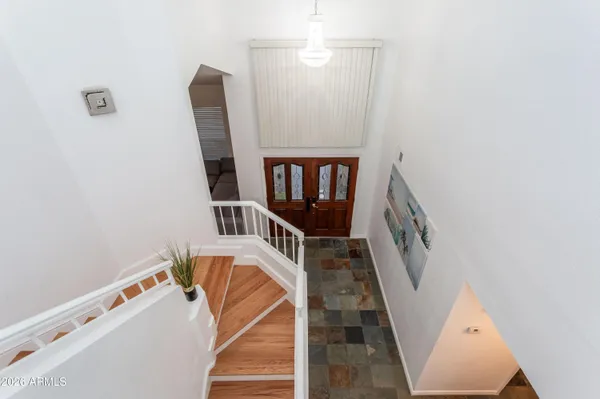 a view of a livingroom with furniture and staircase