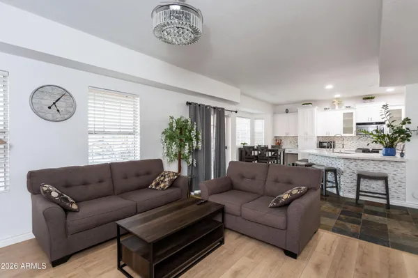 a living room with furniture and a large window