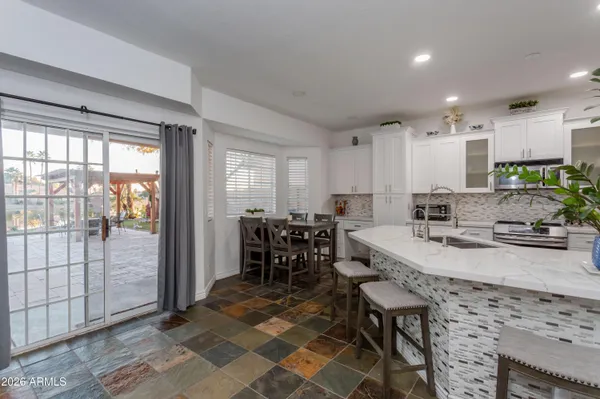 a view of kitchen island dining table and chairs