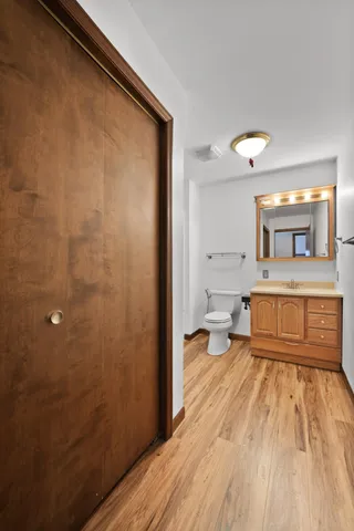a bathroom with a sink a mirror and a toilet