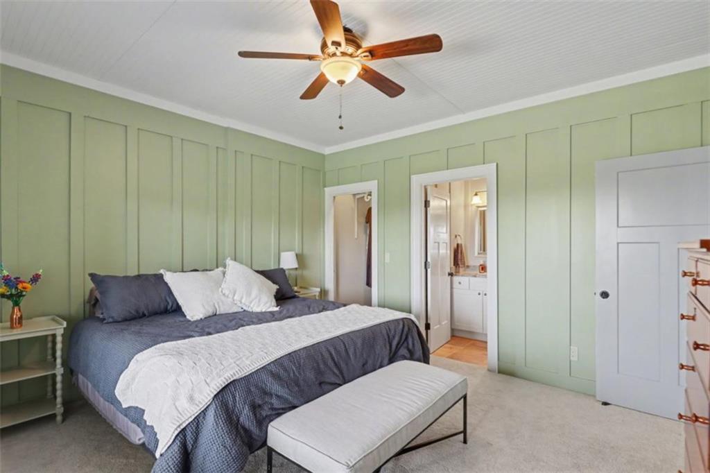 899 Ridge Pointe Way Blairsville, GA 30512 - Photo 51 of 88 a bedroom with a bed and a chandelier