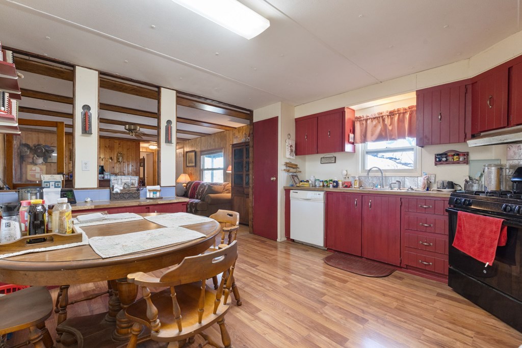 73 Fm 1221 Hext, TX 76848 - Photo 15 of 27 a kitchen with stainless steel appliances wooden cabinets table and chairs