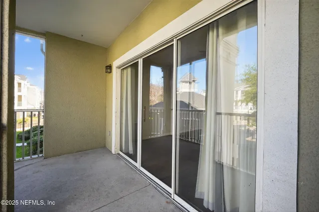 a view of a bathroom with glass door