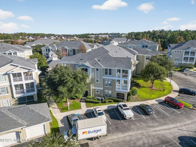 a living room with furniture gym equipment and a large window