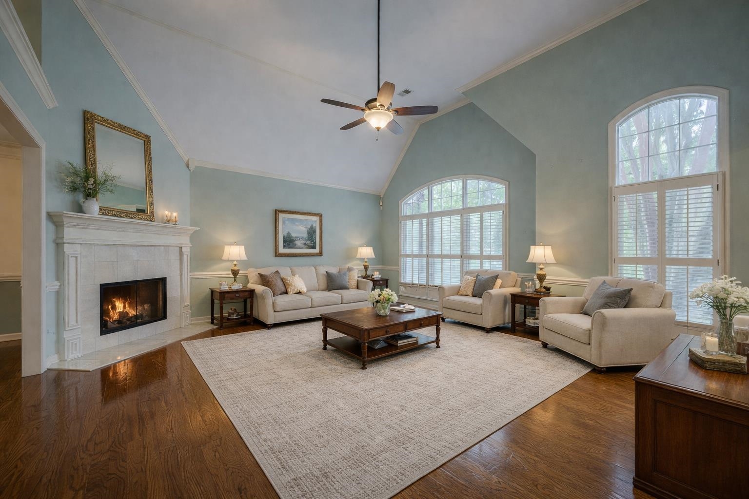 a living room with furniture and a fireplace