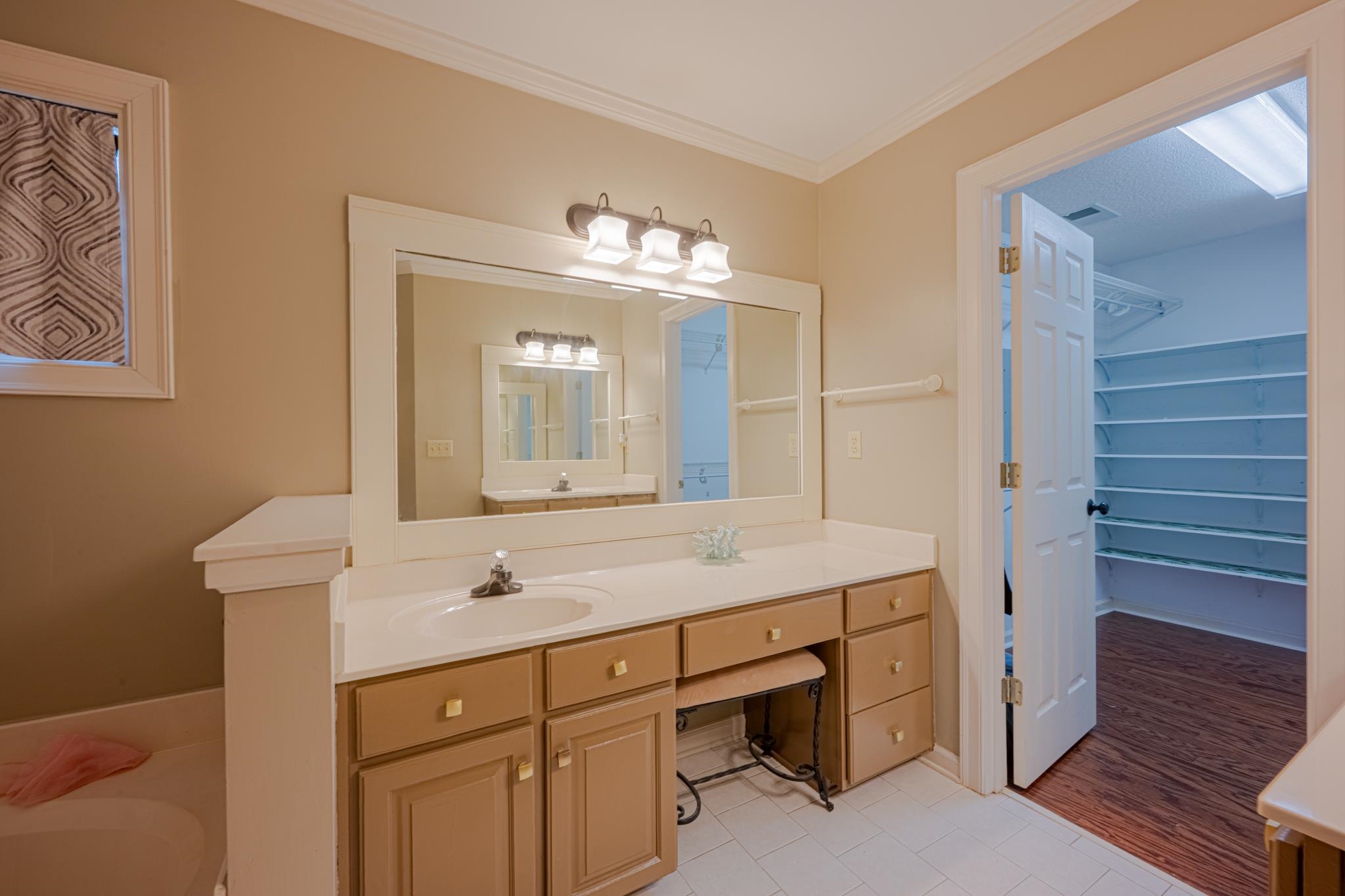 8805 River Rise Drive Memphis, TN 38016 - Photo 21 of 40 a bathroom with a sink and a mirror
