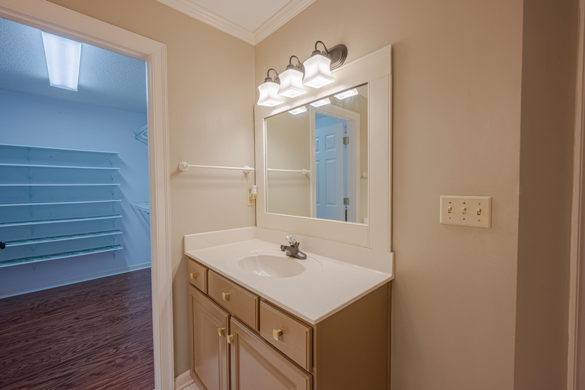 8805 River Rise Drive Memphis, TN 38016 - Photo 23 of 40 a bathroom with a sink and a mirror