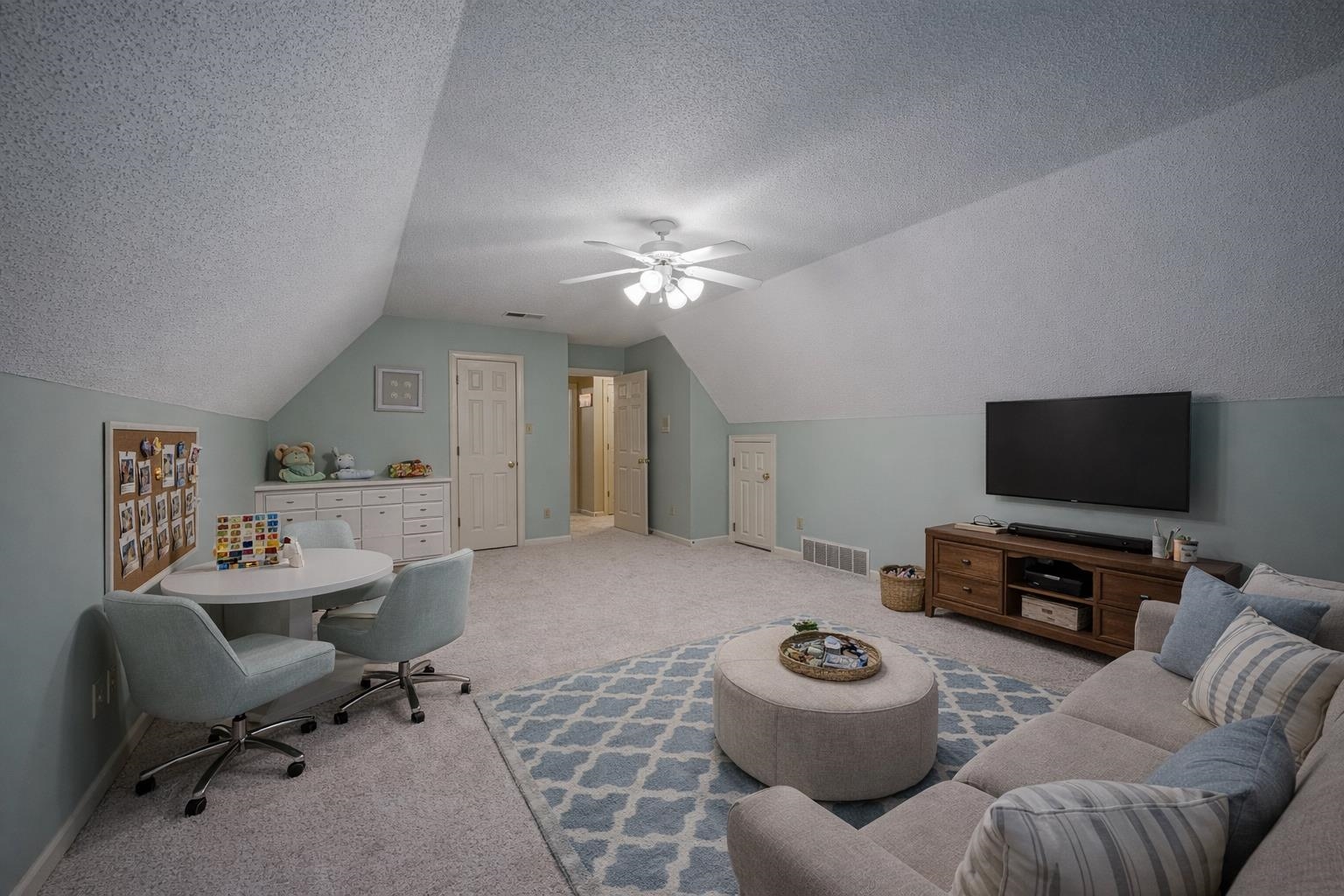 8805 River Rise Drive Memphis, TN 38016 - Photo 30 of 40 a living room with furniture and a flat screen tv