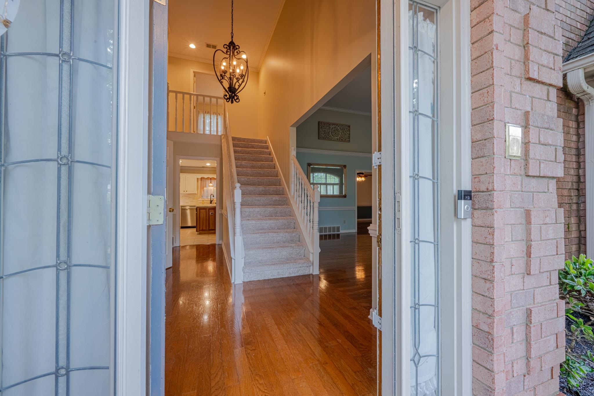 8805 River Rise Drive Memphis, TN 38016 - Photo 5 of 40 a view of a hallway with wooden floor and staircase