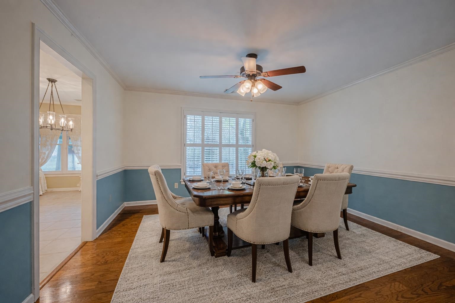 8805 River Rise Drive Memphis, TN 38016 - Photo 7 of 40 Dining space with dark wood finished floors and a ceiling fan. This image has been virtually staged.