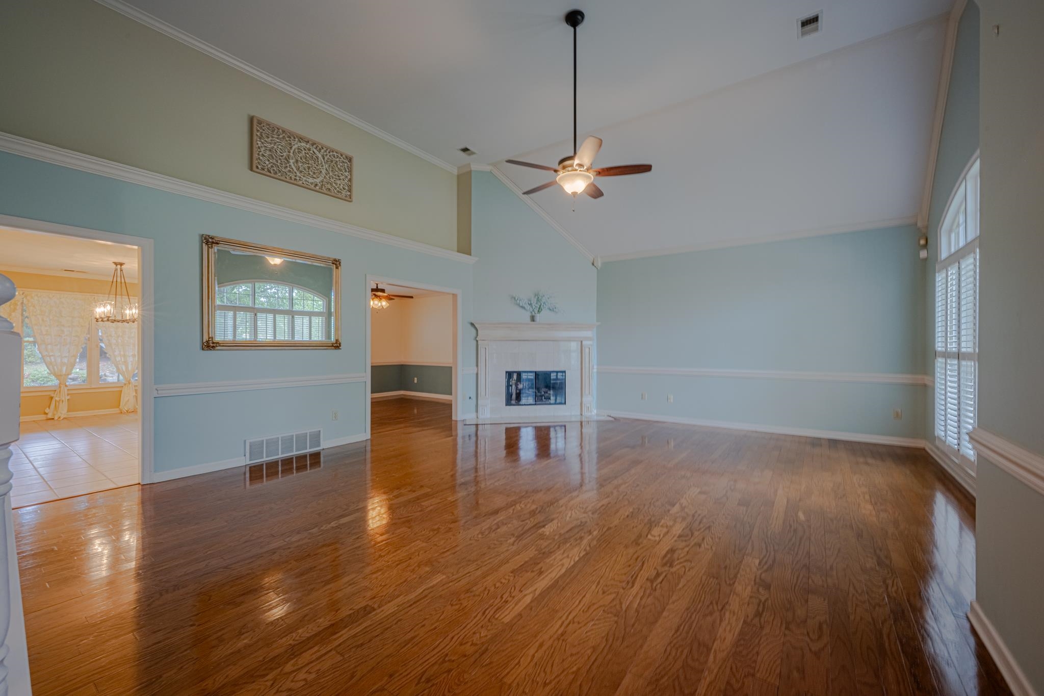 8805 River Rise Drive Memphis, TN 38016 - Photo 9 of 40 a view of empty room with wooden floor and window