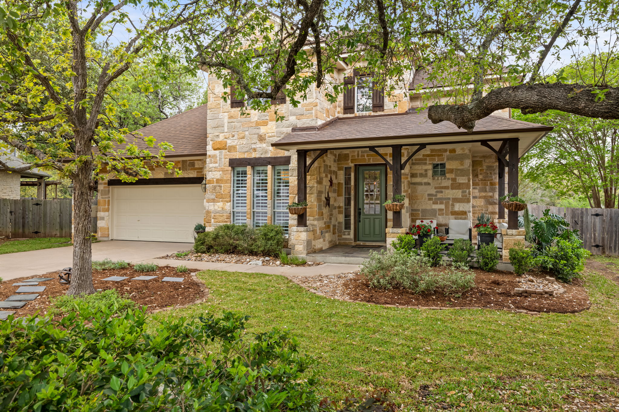 10804 Ariock Lane Austin, TX 78739 - Photo 2 of 32 a front view of a house with garden