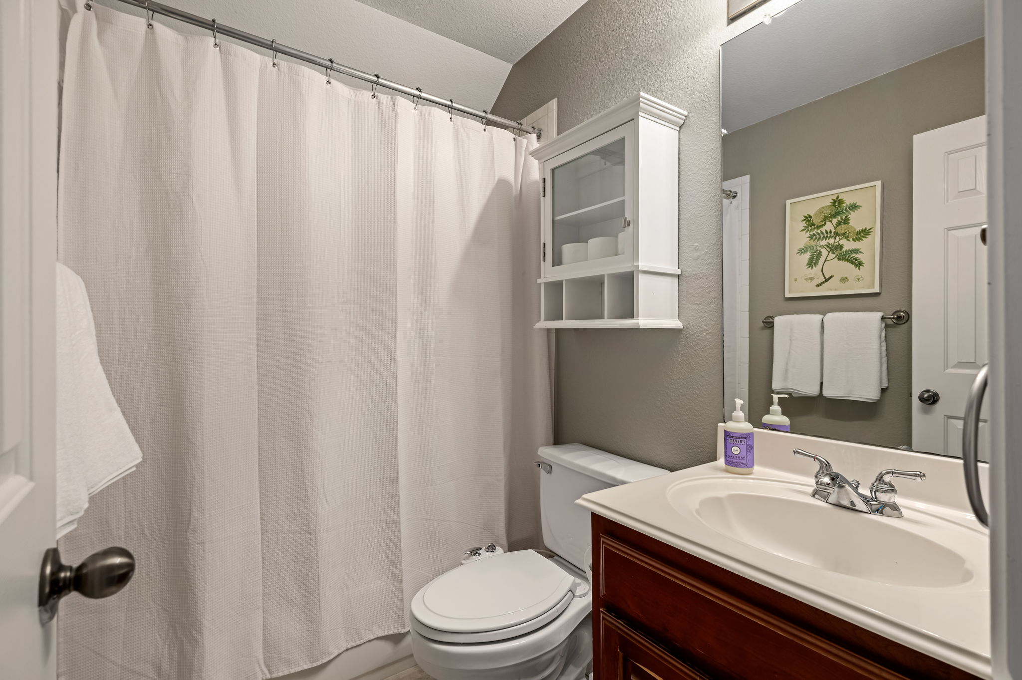 10804 Ariock Lane Austin, TX 78739 - Photo 24 of 32 a bathroom with a sink toilet and shower