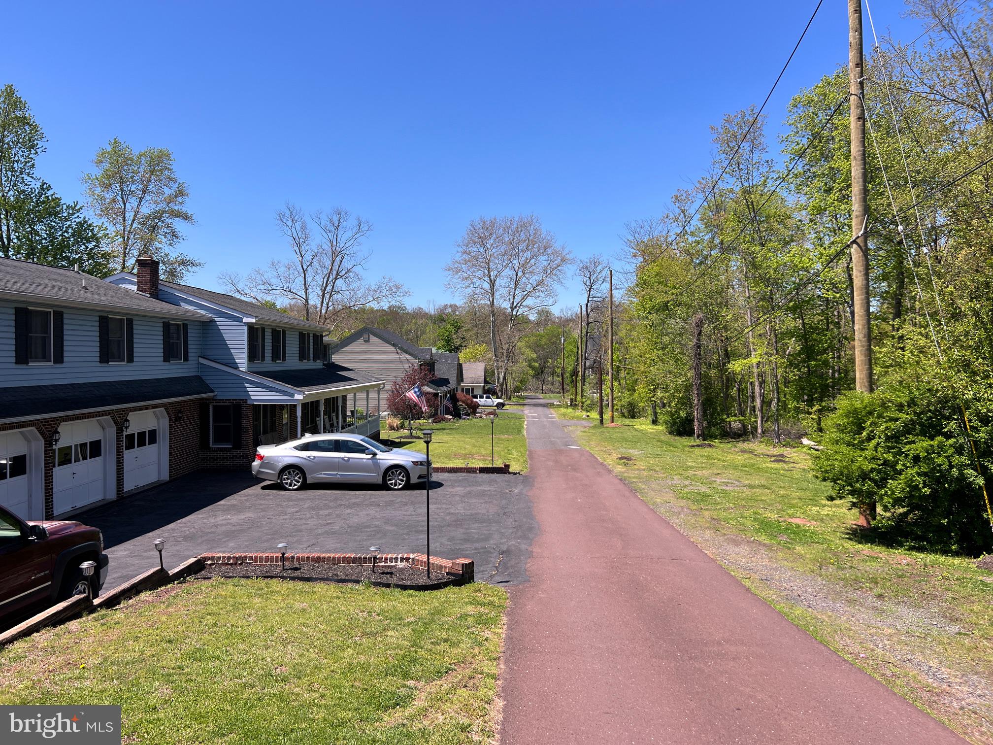 64 Penn Road Collegeville, PA 19426 - Photo 5 of 46 Charming neighborhood under blue skies.