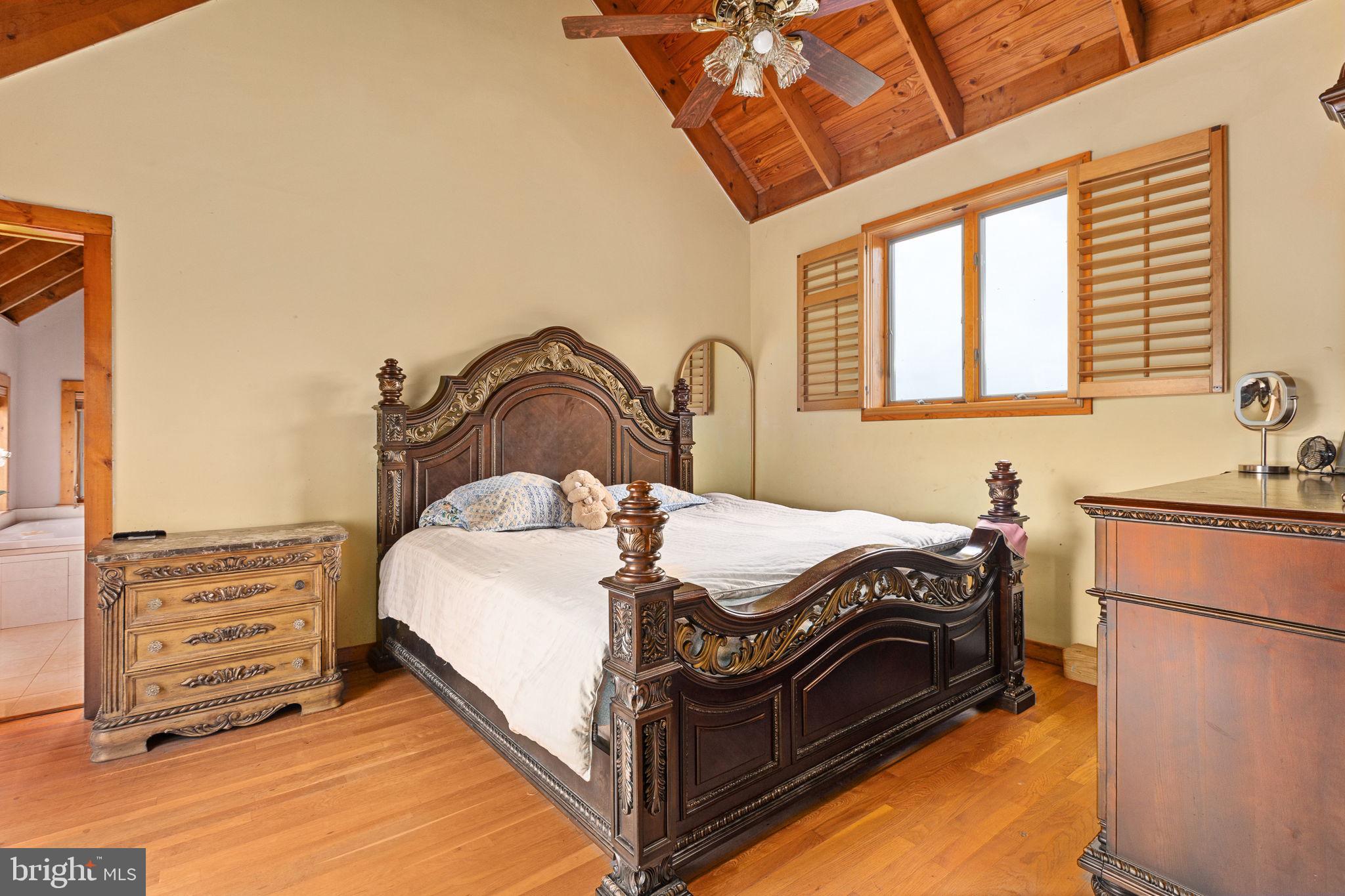 6119 Beach Road Midland, VA 22728 - Photo 20 of 98 a bed sitting in a bedroom next to a window