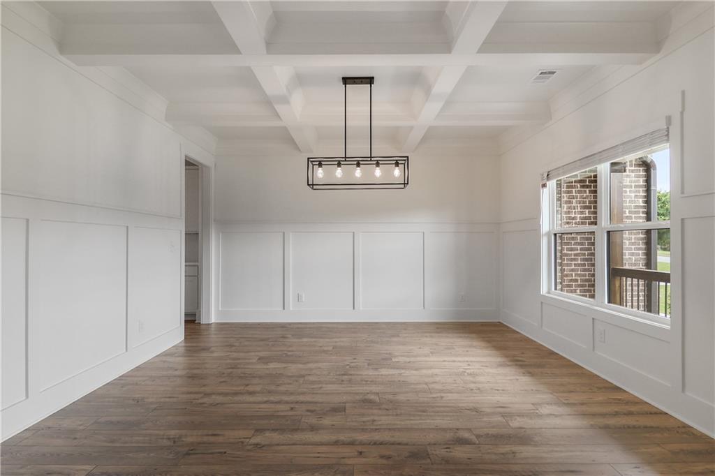 2113 Stonegate Way Monroe, GA 30656 - Photo 11 of 43 wooden floor in an empty room with a window