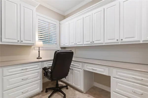 a view with cabinets and piano table