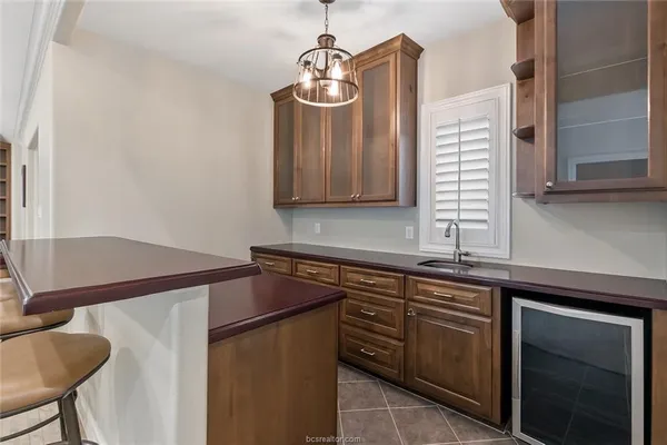a kitchen with a sink and a refrigerator