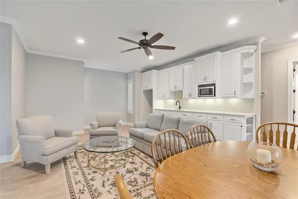 a bedroom with furniture and wooden floor