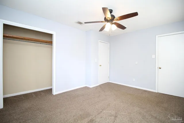 a view of a big room with closet in it