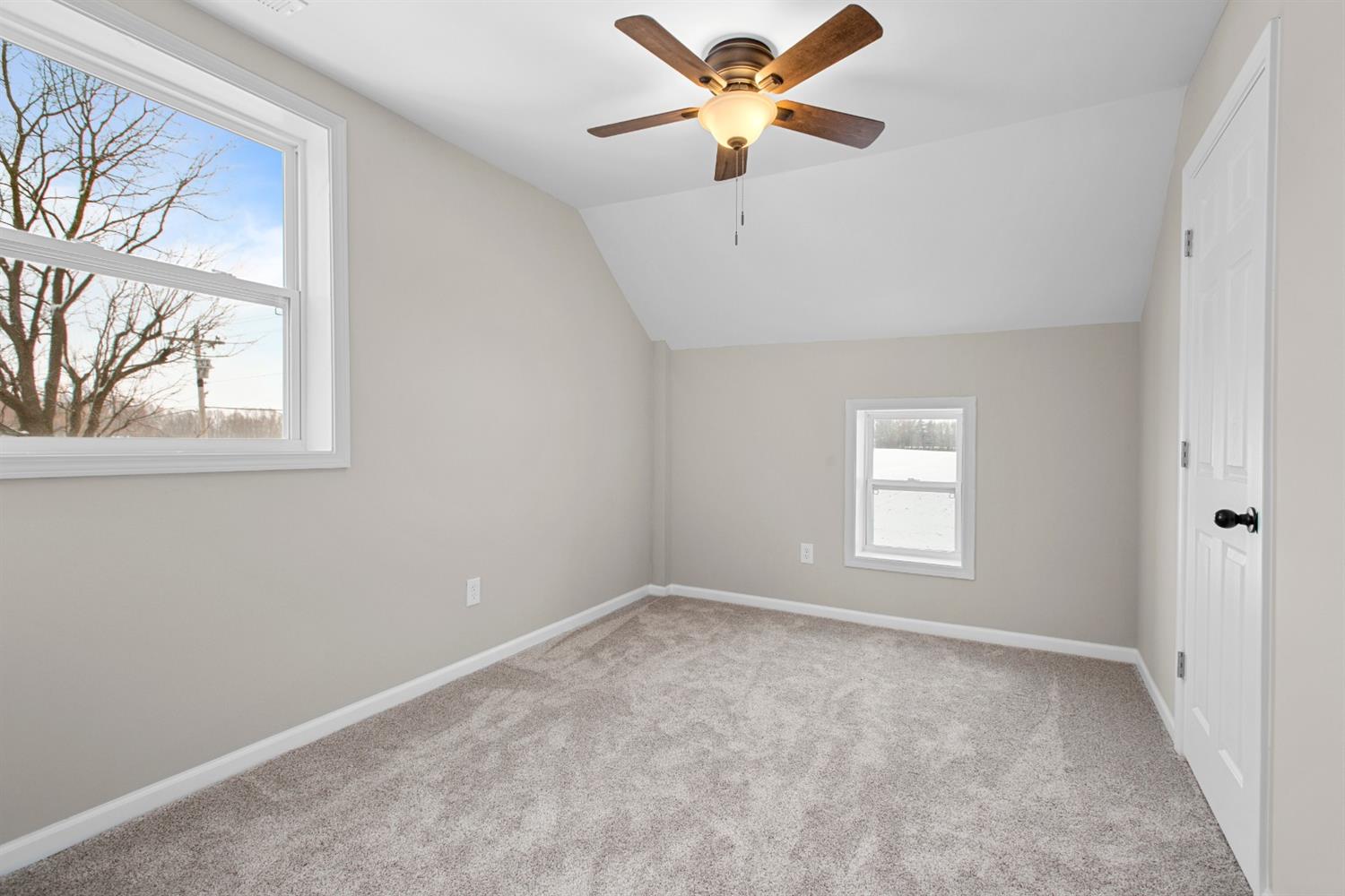 283 West Division Road Valparaiso, IN 46385 - Photo 13 of 17 an empty room with windows and fan