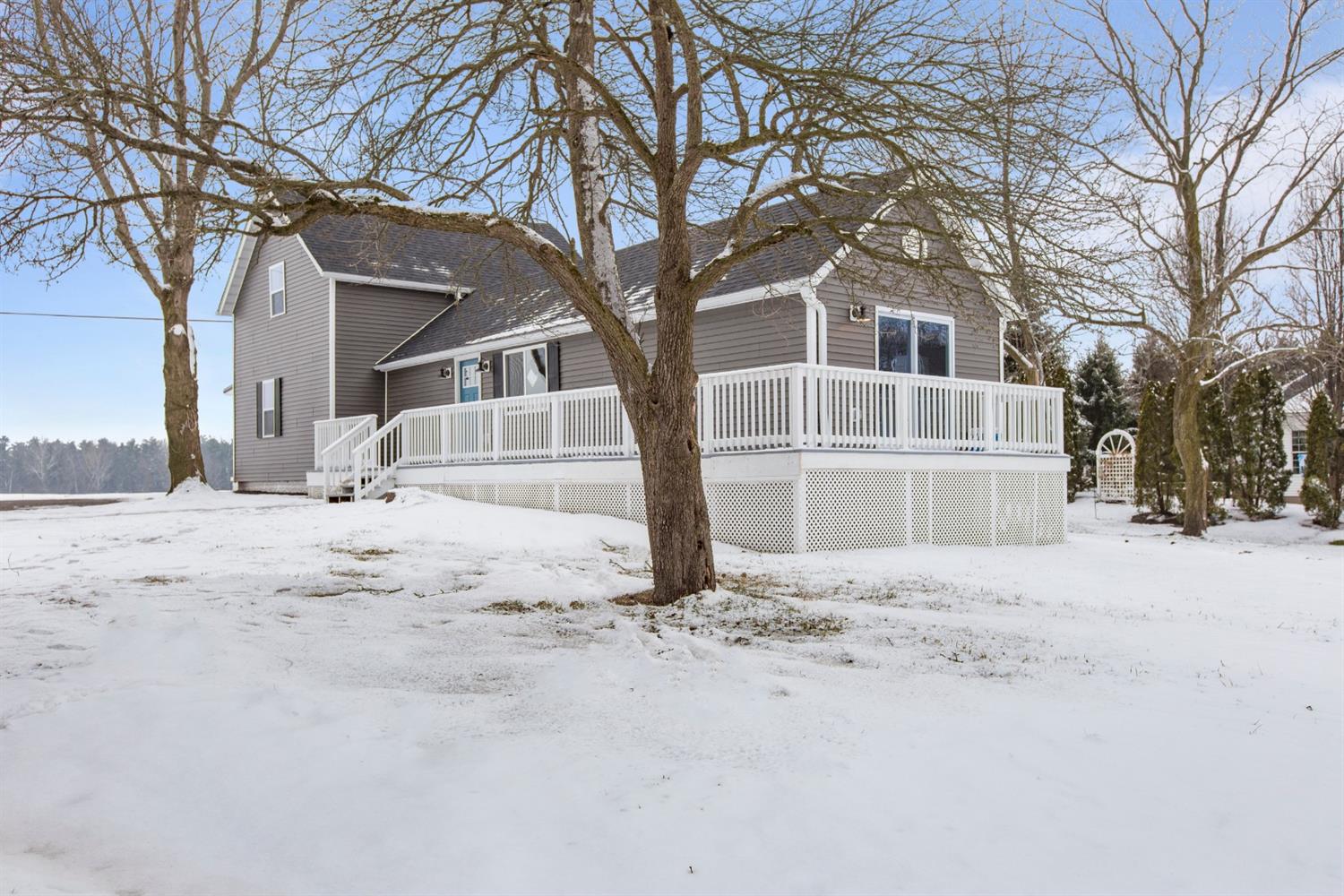 283 West Division Road Valparaiso, IN 46385 - Photo 17 of 17 a white house that has a tree in front of it