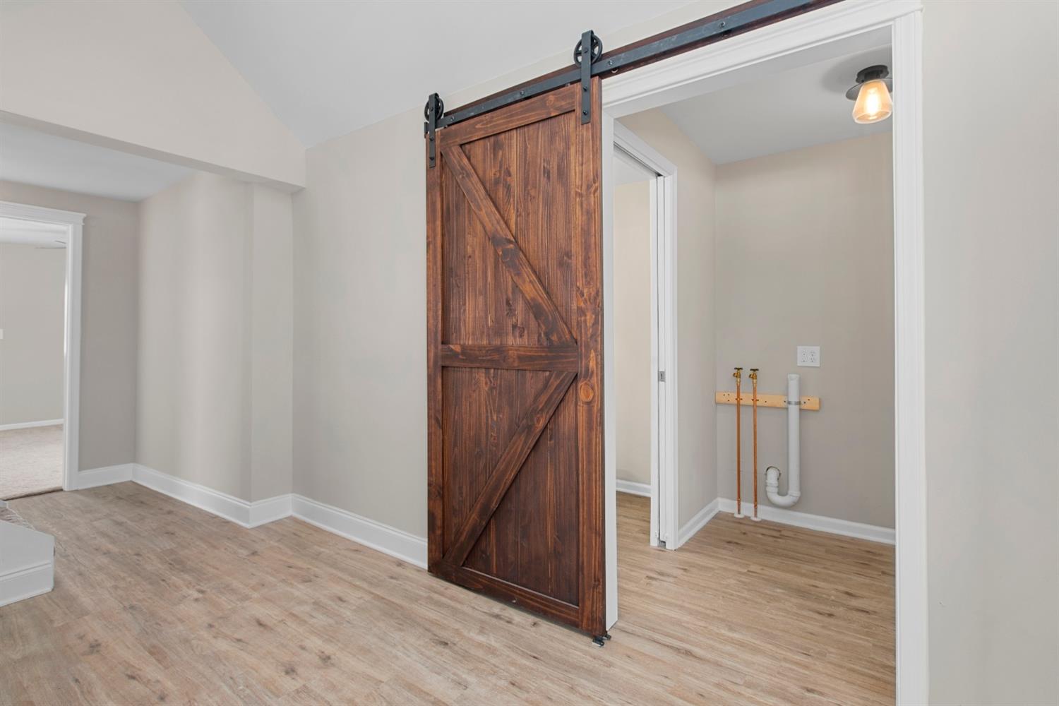 283 West Division Road Valparaiso, IN 46385 - Photo 7 of 17 a view of a hallway with wooden floor and entryway