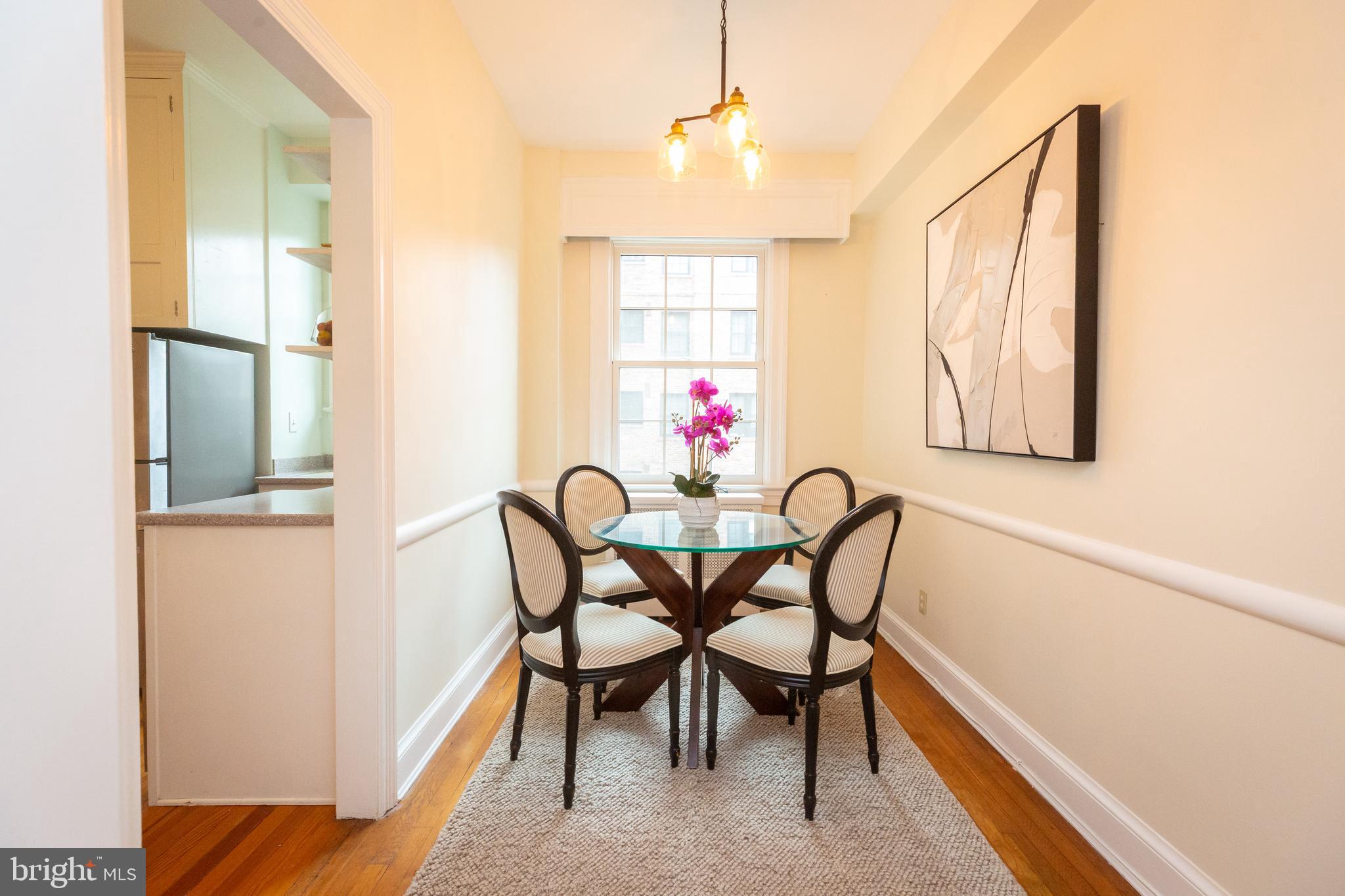 3900 Connecticut Avenue Northwest, Unit 306F Washington, DC 20008 - Photo 11 of 33 a view of a dining room with furniture and window