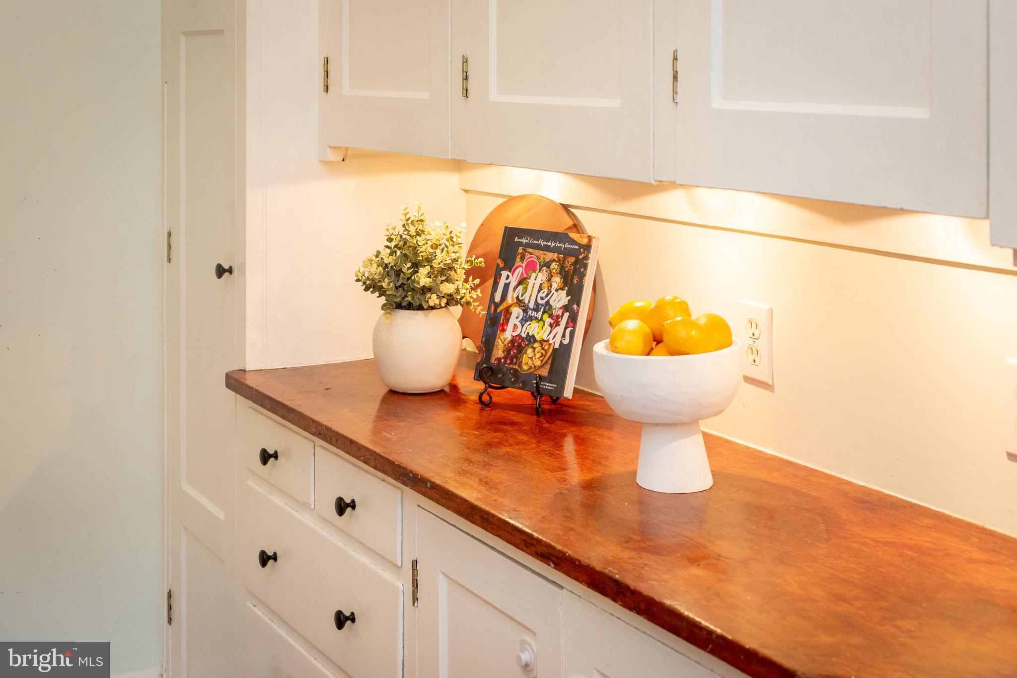 3900 Connecticut Avenue Northwest, Unit 306F Washington, DC 20008 - Photo 13 of 33 a kitchen with a sink and a white cabinets