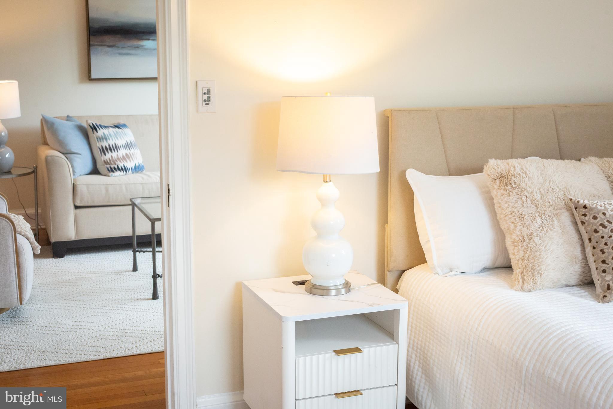 3900 Connecticut Avenue Northwest, Unit 306F Washington, DC 20008 - Photo 16 of 33 a bedroom with a bed and a couch