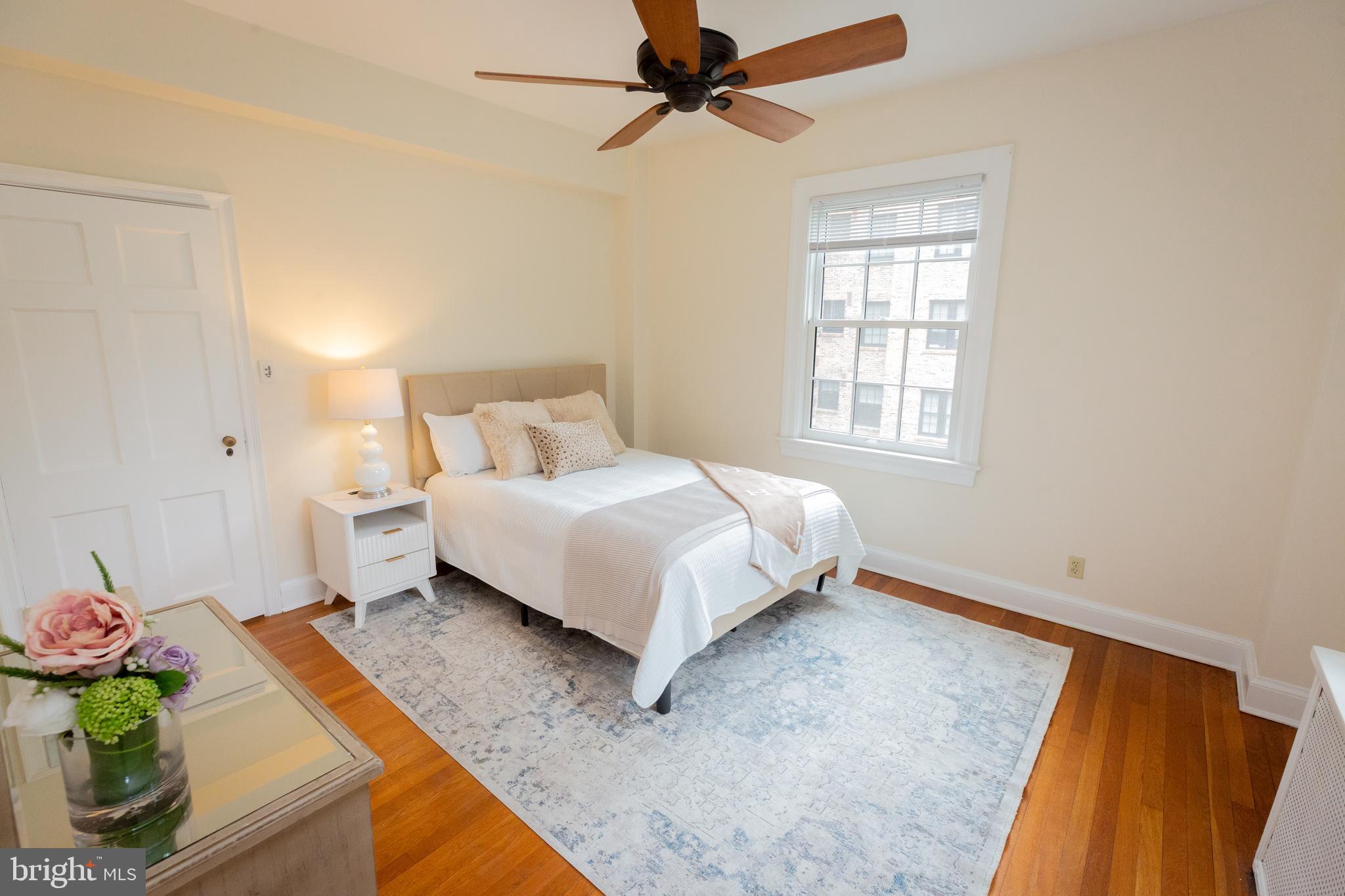 3900 Connecticut Avenue Northwest, Unit 306F Washington, DC 20008 - Photo 18 of 33 a bed room with a bed and a window