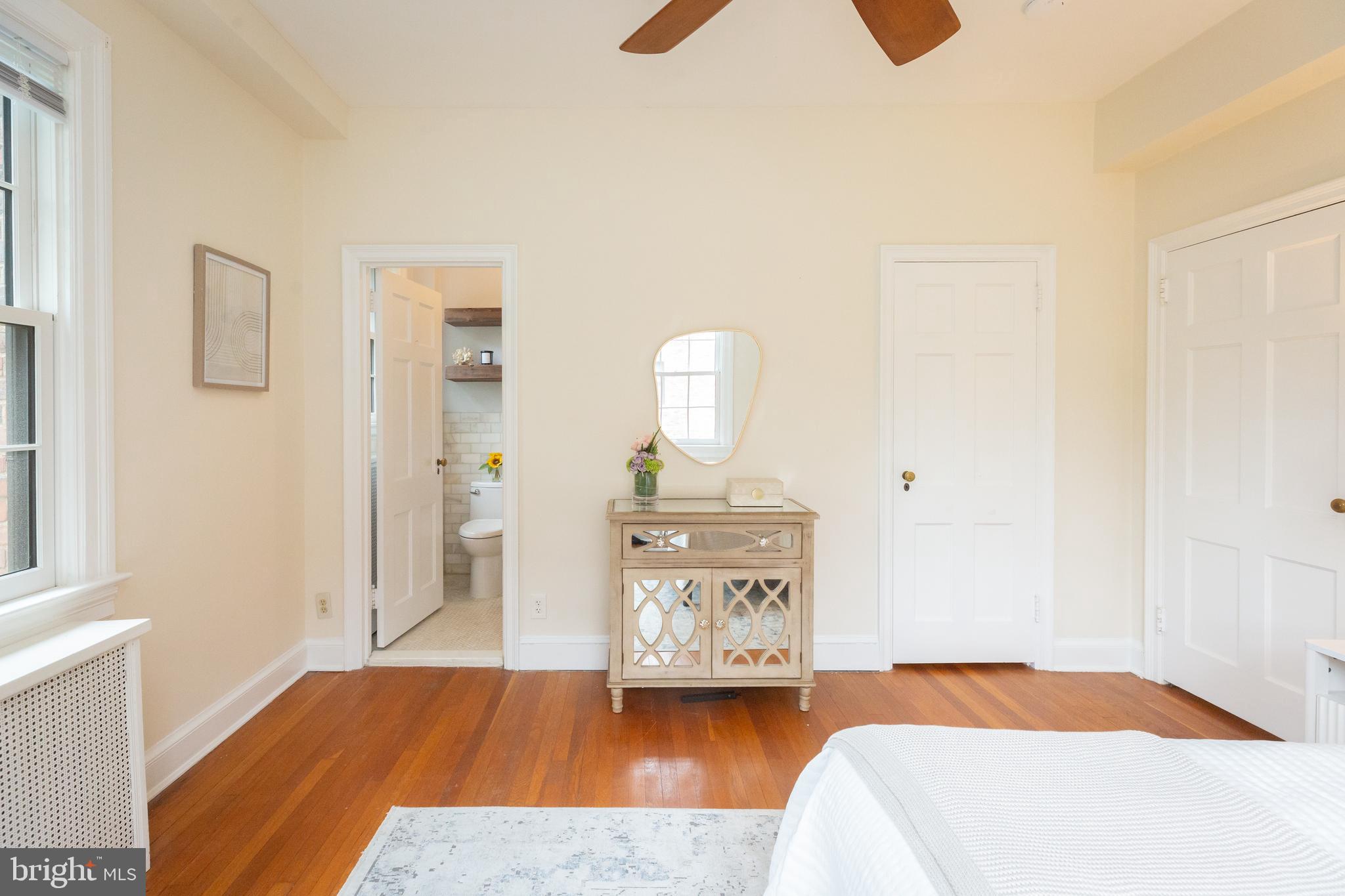 3900 Connecticut Avenue Northwest, Unit 306F Washington, DC 20008 - Photo 19 of 33 a bedroom with a bed and wooden floor