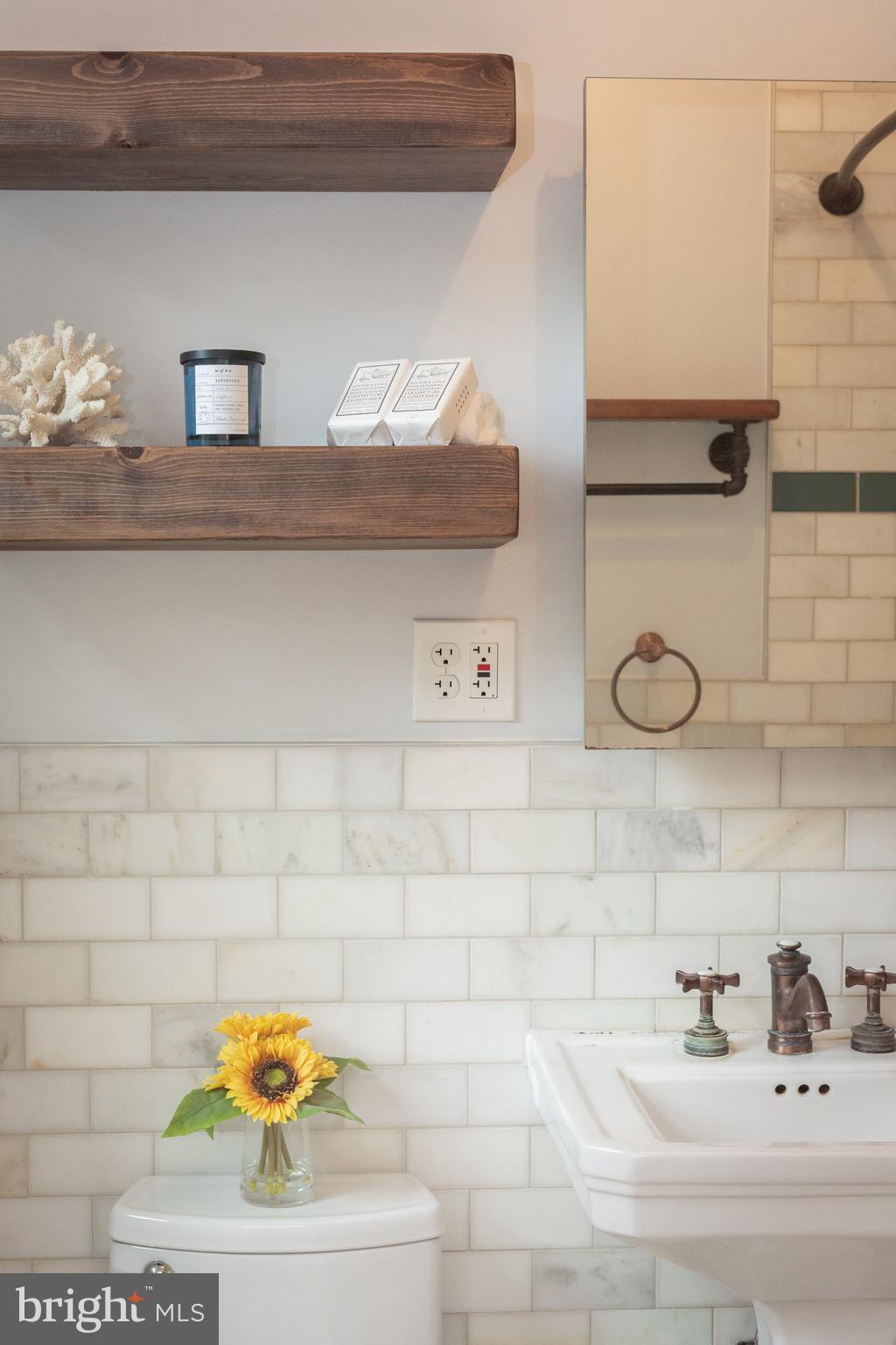 3900 Connecticut Avenue Northwest, Unit 306F Washington, DC 20008 - Photo 20 of 33 a bathroom with a sink and a mirror