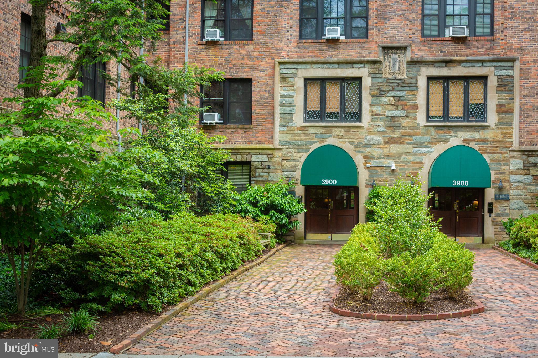 3900 Connecticut Avenue Northwest, Unit 306F Washington, DC 20008 - Photo 2 of 33 a front view of a house with a yard