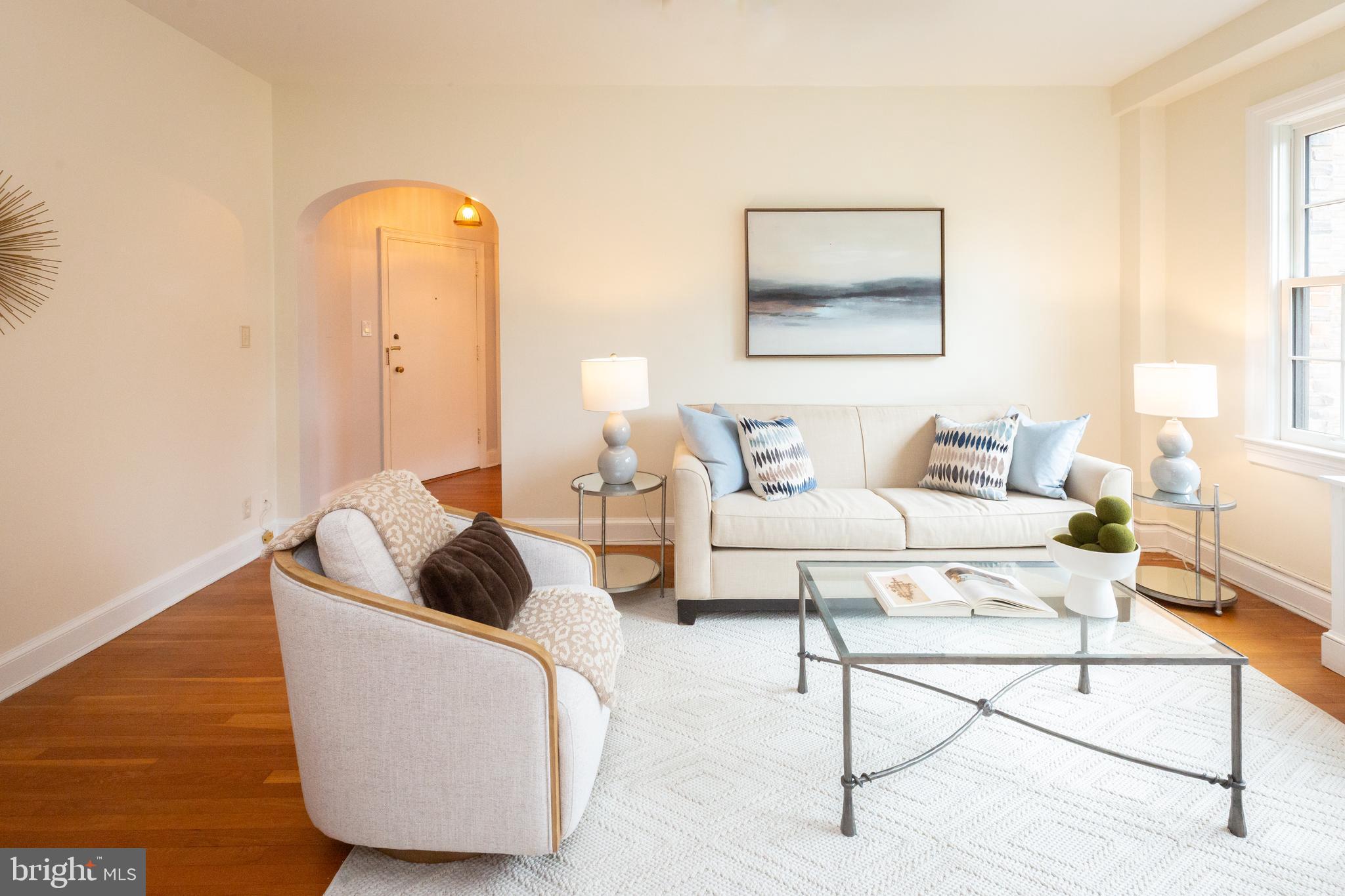 3900 Connecticut Avenue Northwest, Unit 306F Washington, DC 20008 - Photo 5 of 33 a living room with furniture and a wooden floor