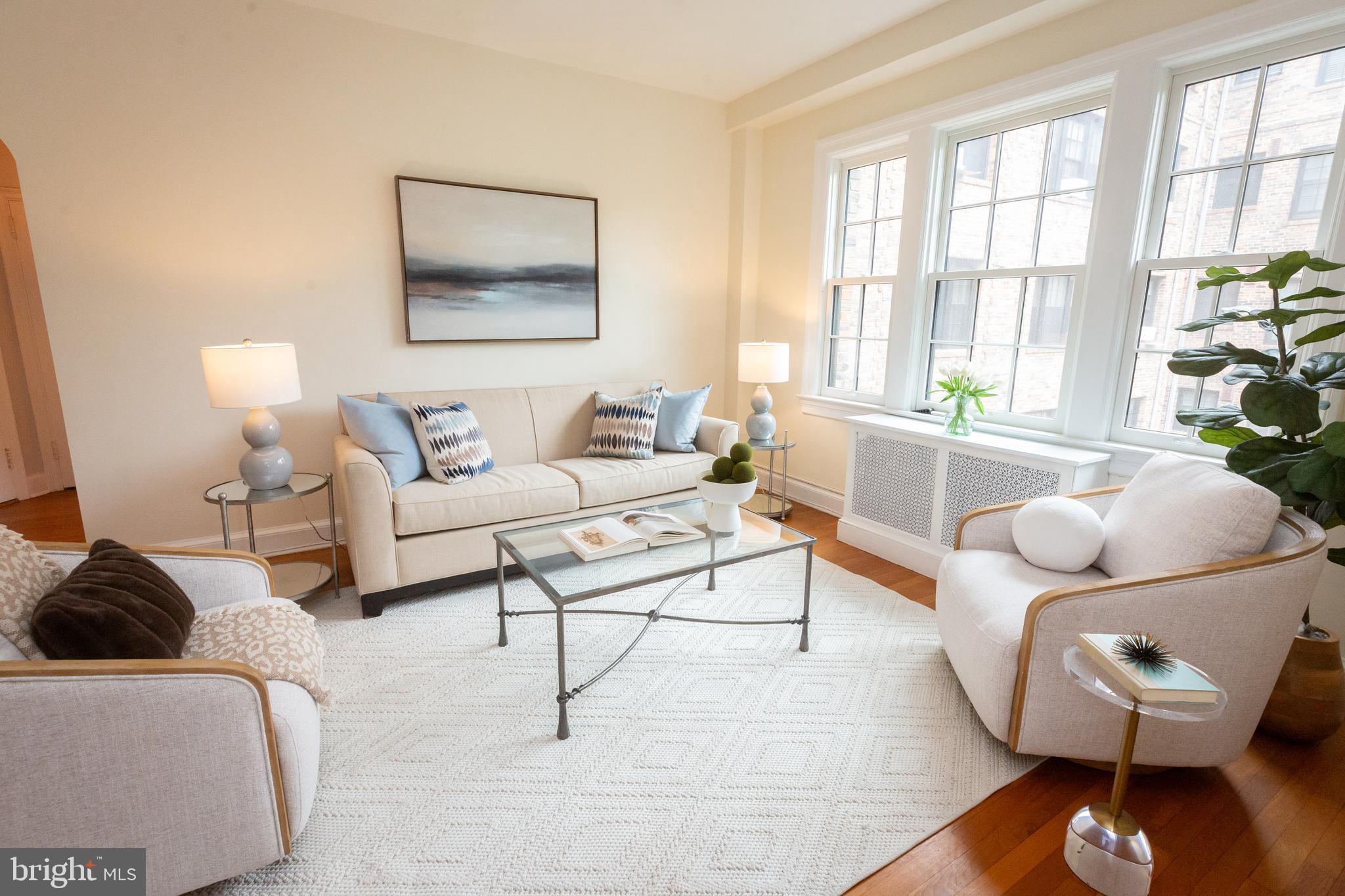 3900 Connecticut Avenue Northwest, Unit 306F Washington, DC 20008 - Photo 10 of 33 a living room with furniture and a large window
