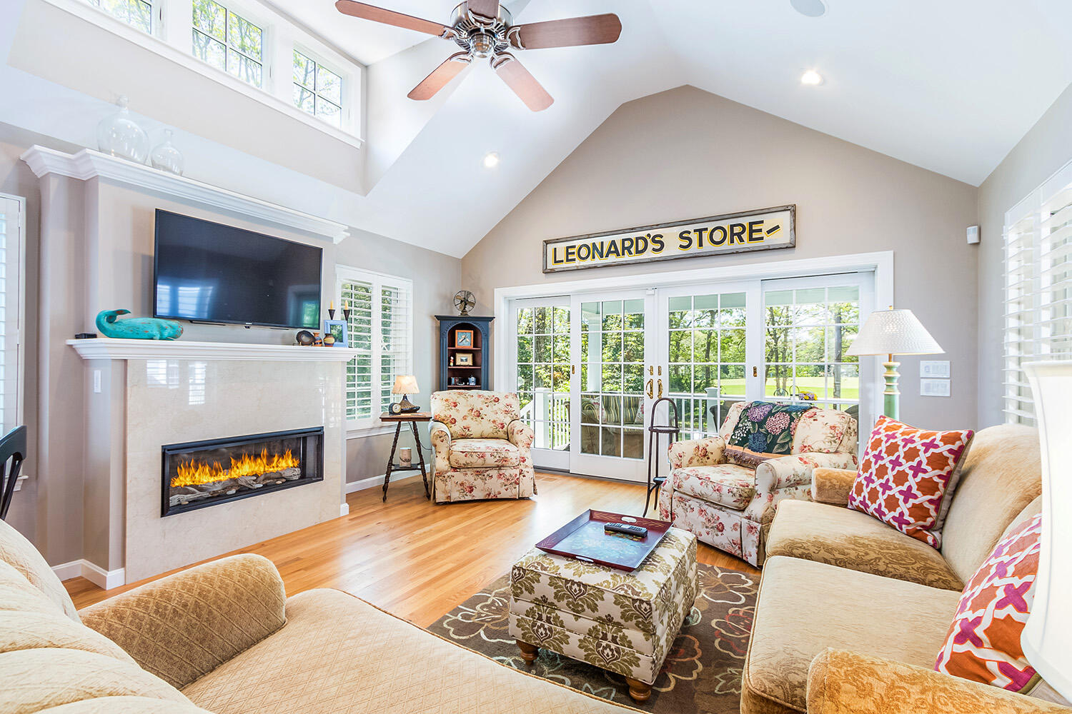 243 Parker Road Osterville, MA 02655 - Photo 11 of 34 a living room with furniture a flat screen tv and a fireplace