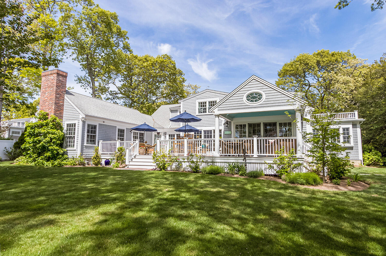 243 Parker Road Osterville, MA 02655 - Photo 2 of 34 a front view of a house with a garden