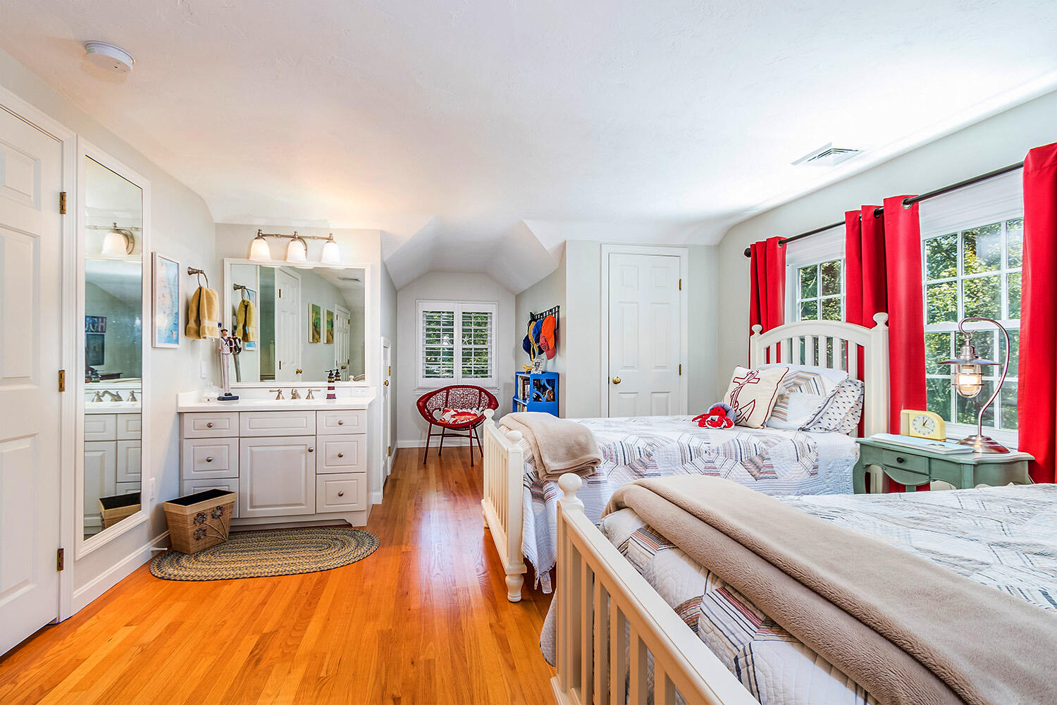 243 Parker Road Osterville, MA 02655 - Photo 24 of 34 a bedroom with furniture and a wooden floor