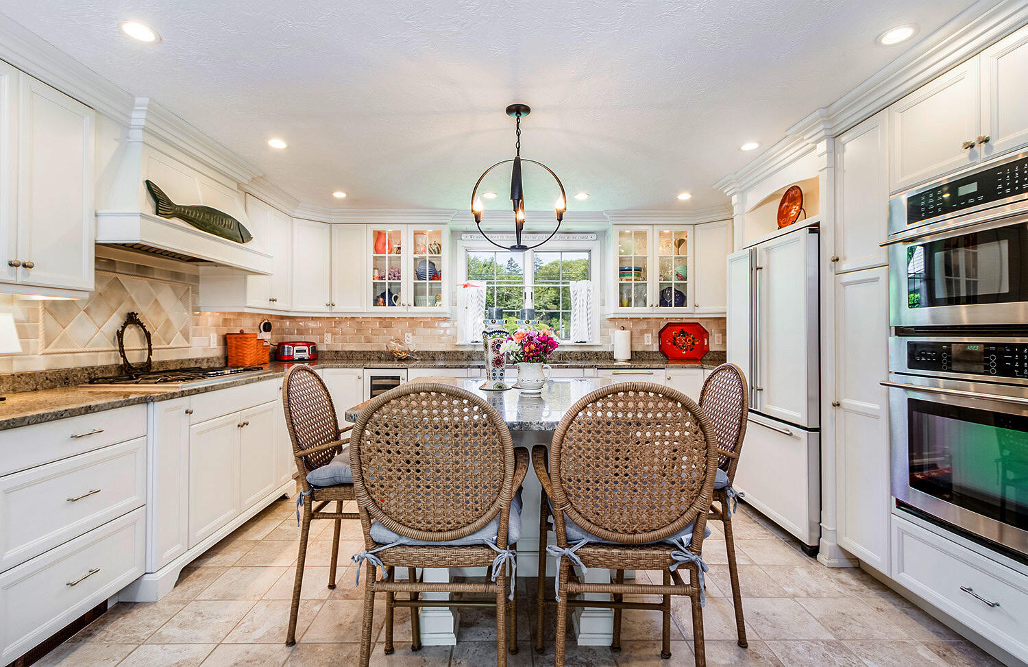 243 Parker Road Osterville, MA 02655 - Photo 4 of 34 a dining room filled chandelier and wooden floor