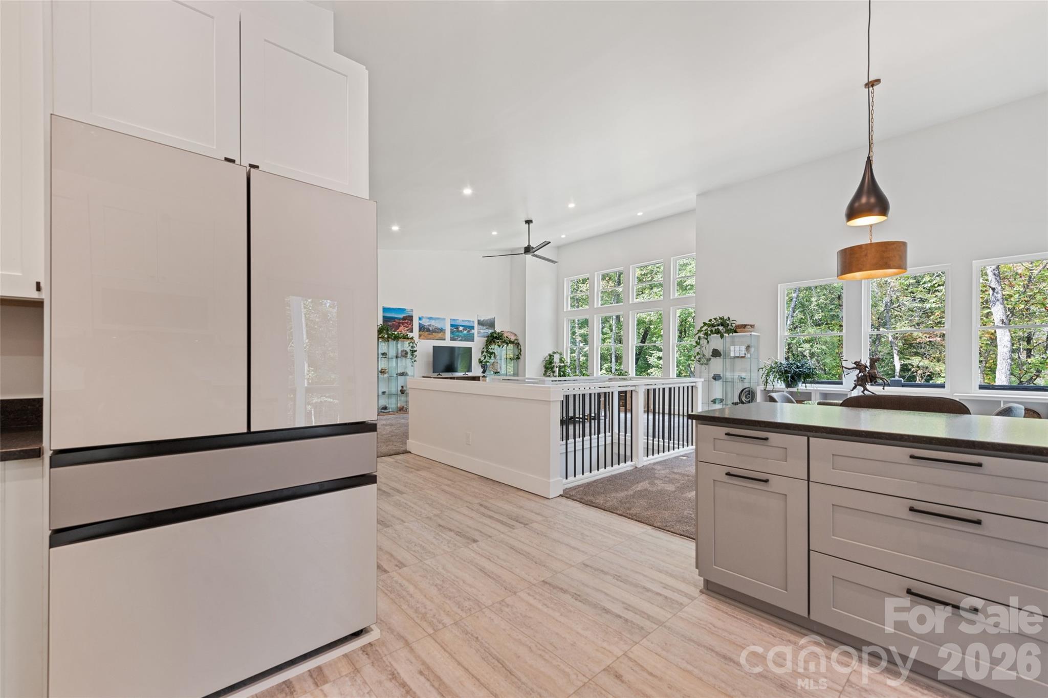 1185 Wallalieu Road Otto, NC 28763 - Photo 18 of 43 a kitchen with stainless steel appliances a sink and wooden floor