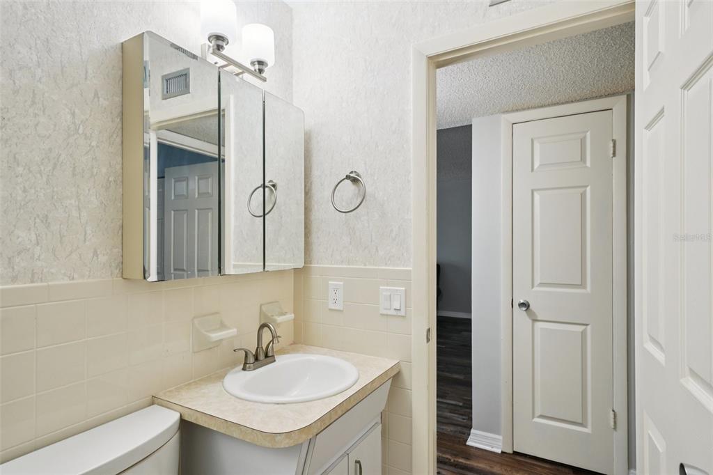 2255 Philippine Drive, Unit 9 Clearwater, FL 33763 - Photo 26 of 47 a bathroom with a sink and a mirror