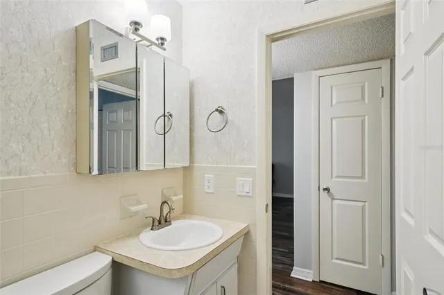 a bathroom with a sink and a mirror