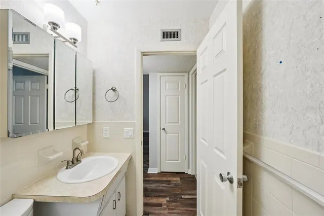 a bathroom with a sink and a mirror
