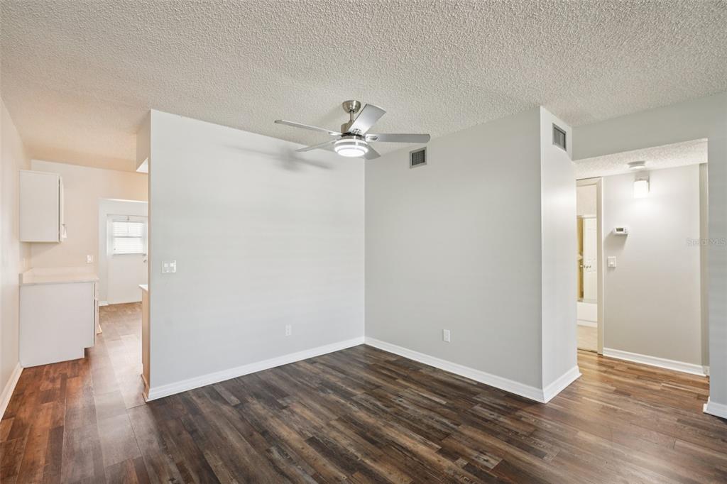 2255 Philippine Drive, Unit 9 Clearwater, FL 33763 - Photo 8 of 47 a view of an empty room with wooden floor